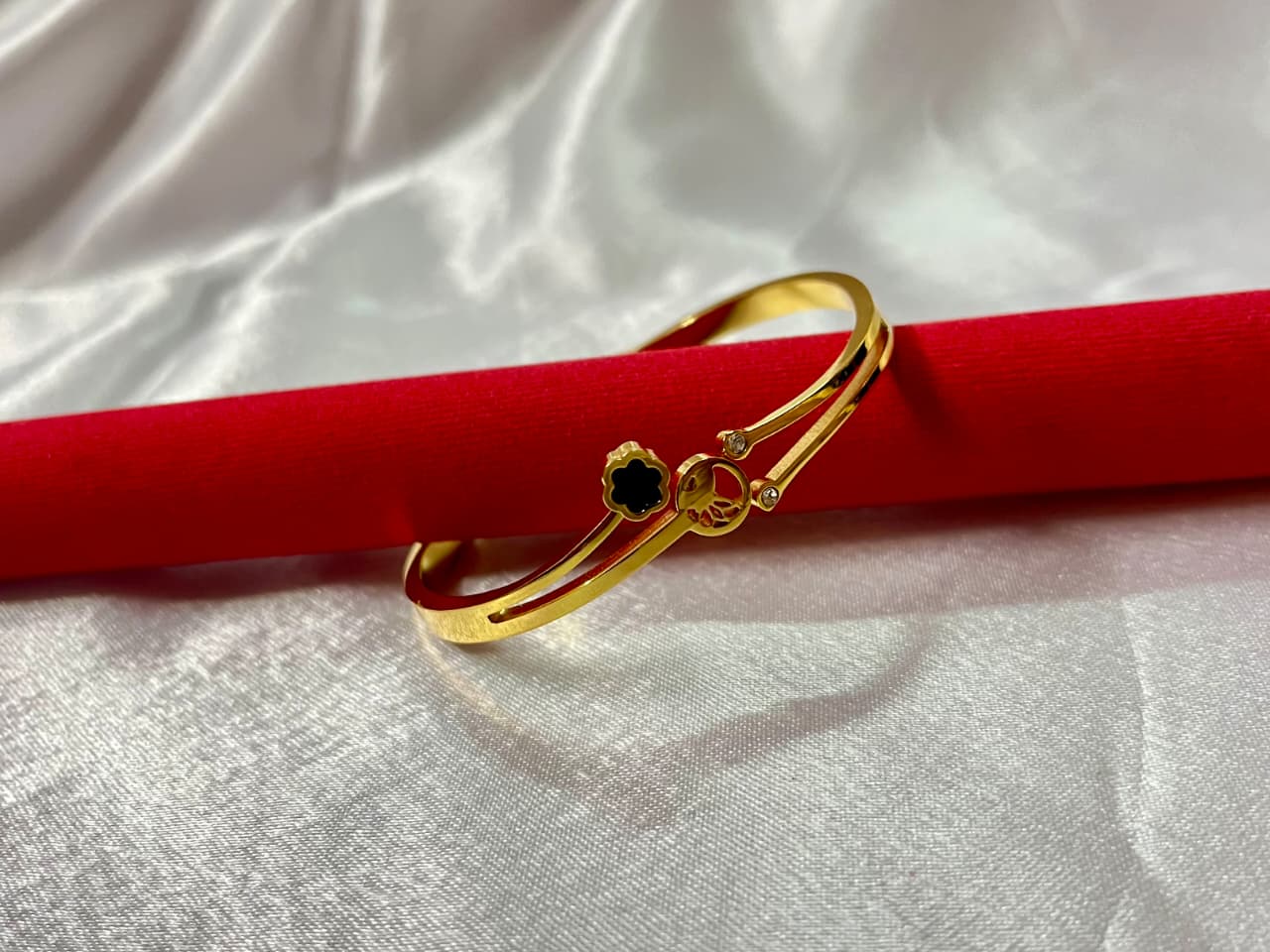 Elegant Gold-Plated Kada with Black Floral Charm