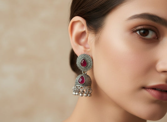 Traditional Oxidized Silver-Toned Jhumka Earrings with Red Stone