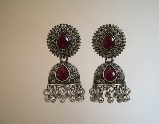Traditional Oxidized Silver-Toned Jhumka Earrings with Red Stone