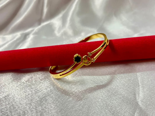 Elegant Gold-Plated Kada with Black Floral Charm