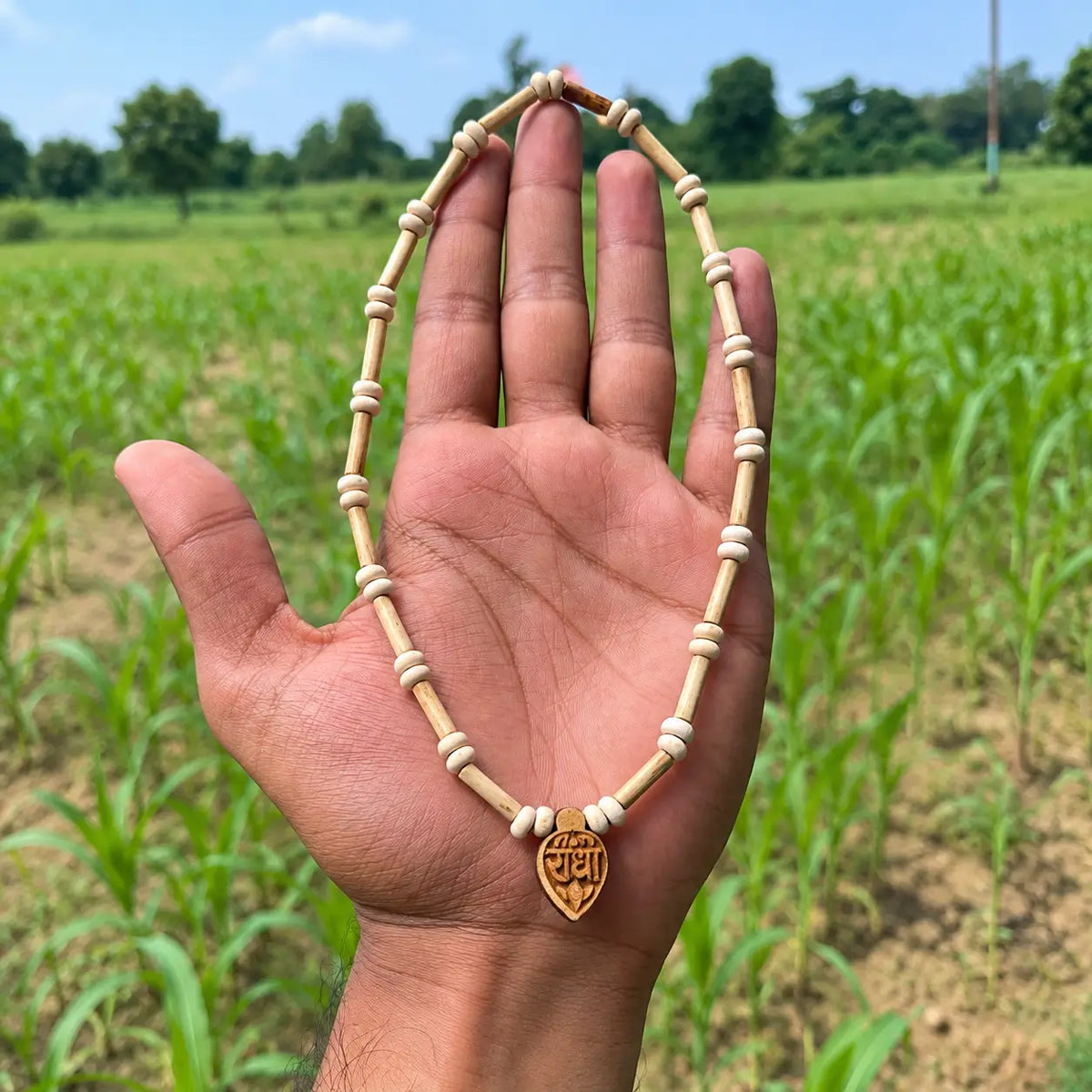 Pure Tulsi kanthi mala with carved Radha pendant, cylindrical Tulsi beads