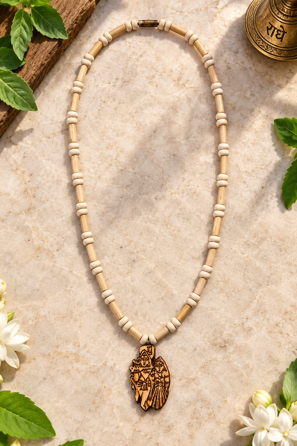 Pure Tulsi mala with Radha Krishna pendant held in hand