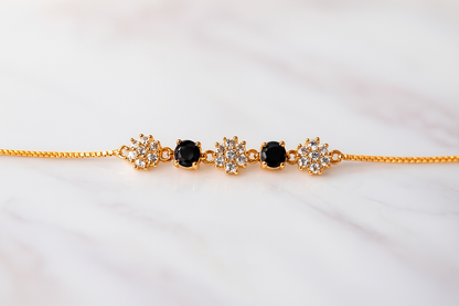 Elegant Gold-Plated Bracelet with Black & White Floral Stones