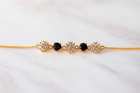 Elegant Gold-Plated Bracelet with Black & White Floral Stones